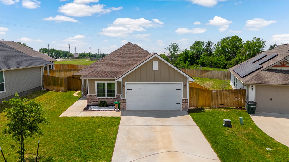 a front view of a house with yard