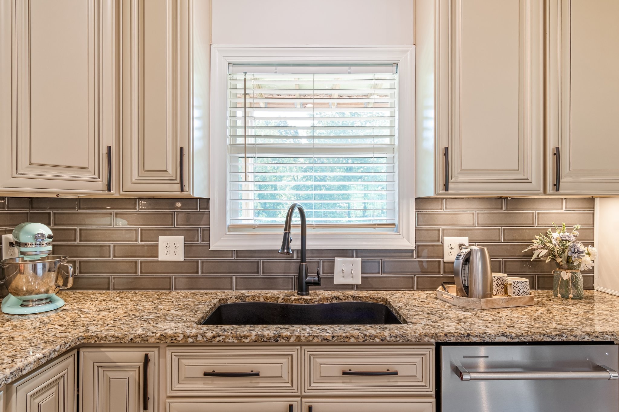 1685 Center Star Road Columbia, TN 38401 - Photo 21 of 68 a kitchen with granite countertop kitchen island white cabinets and a window