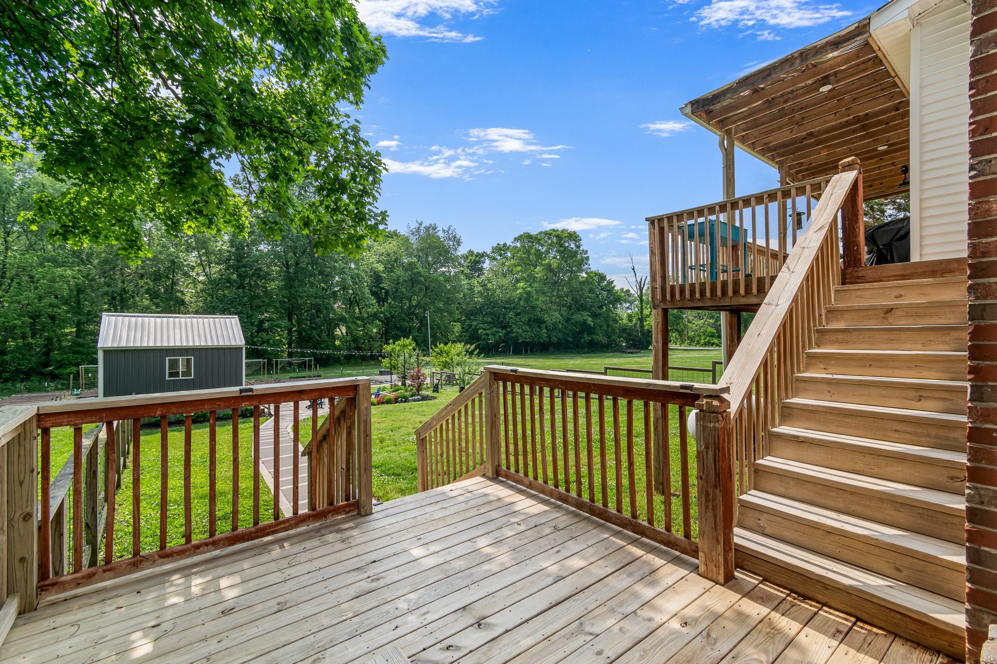 1685 Center Star Road Columbia, TN 38401 - Photo 51 of 68 a view of a wooden deck and a yard with swimming pool