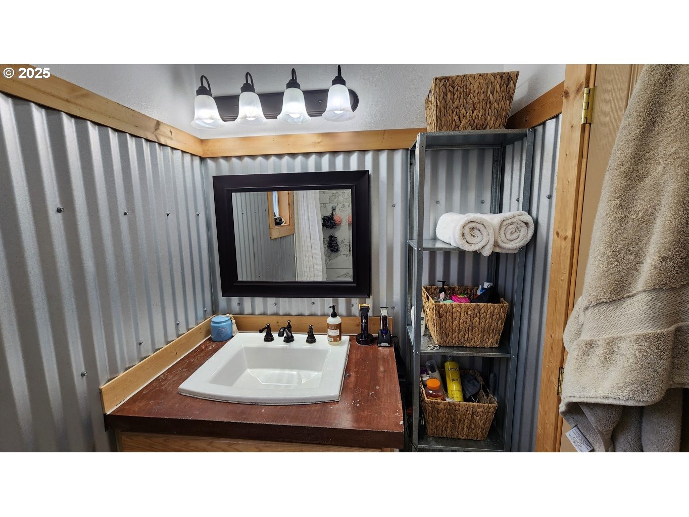 404 Southwest Depot Street Enterprise, OR 97828 - Photo 15 of 32 a bathroom with a sink a mirror and a toilet