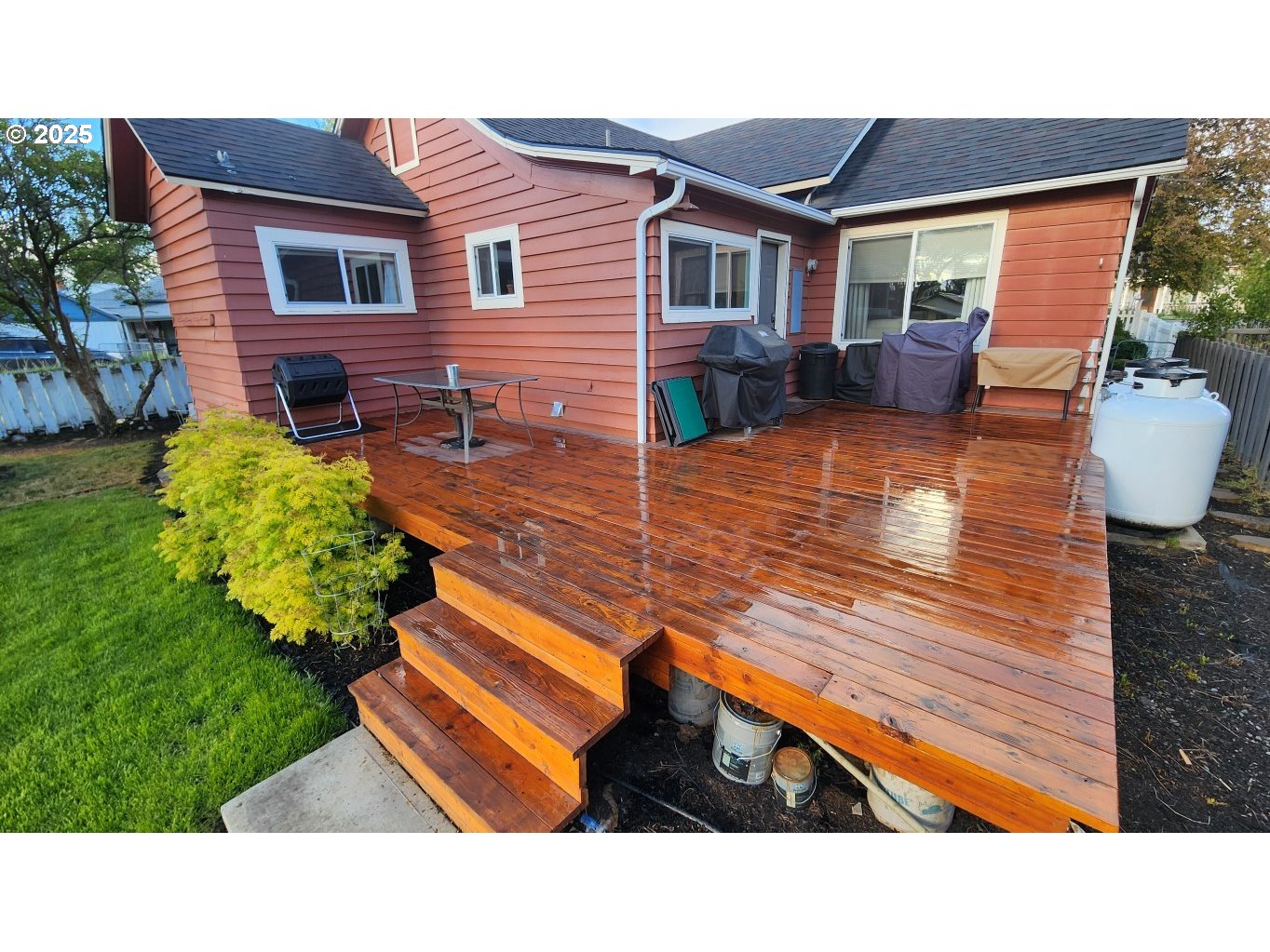 404 Southwest Depot Street Enterprise, OR 97828 - Photo 18 of 32 a backyard of a house with wooden floor and outdoor seating