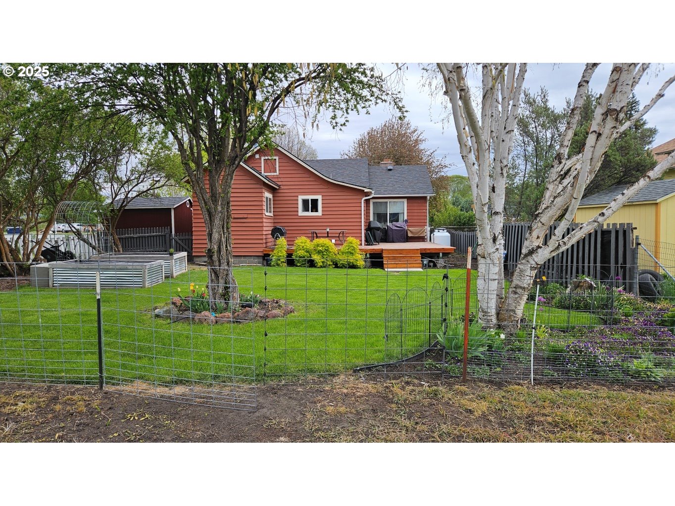404 Southwest Depot Street Enterprise, OR 97828 - Photo 25 of 32 a black and white house with a yard