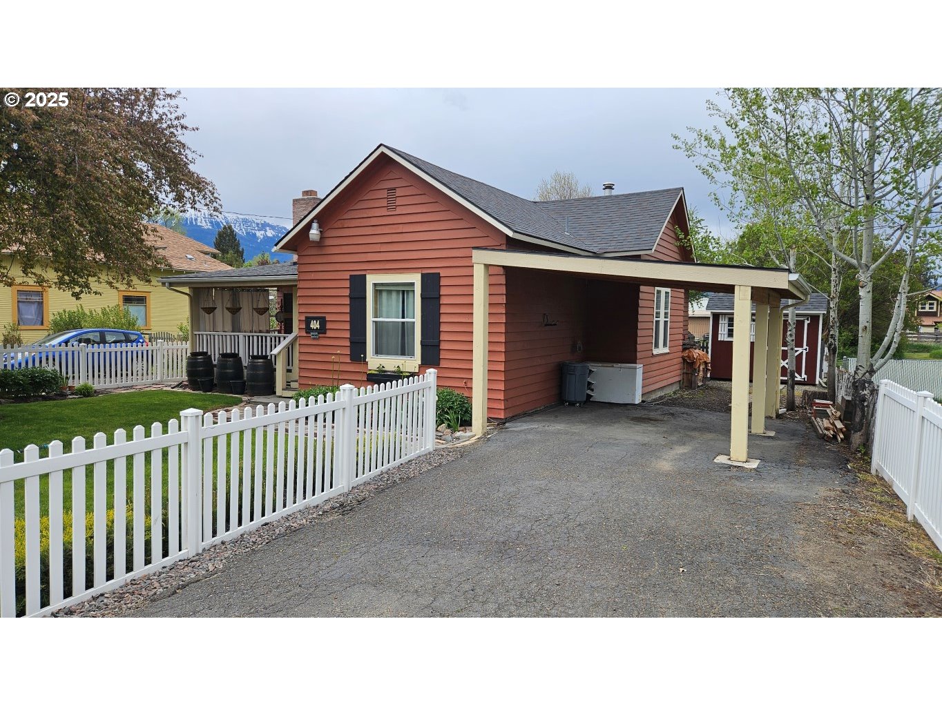 404 Southwest Depot Street Enterprise, OR 97828 - Photo 30 of 32 a black and white house with a large window and wooden fence