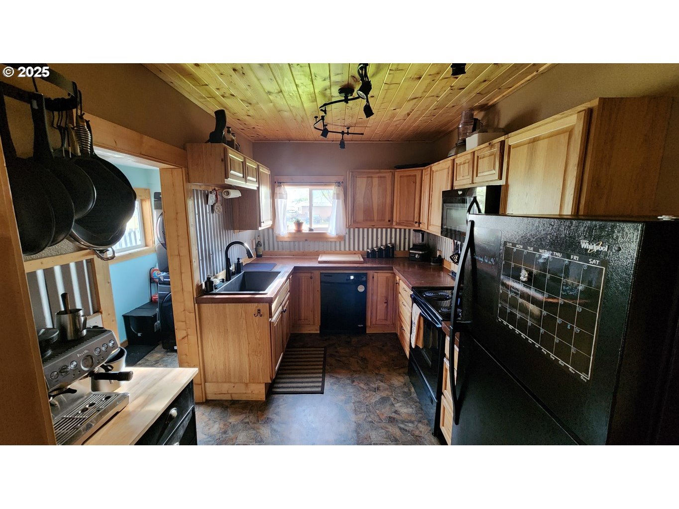404 Southwest Depot Street Enterprise, OR 97828 - Photo 7 of 32 a kitchen with a sink window and cabinets