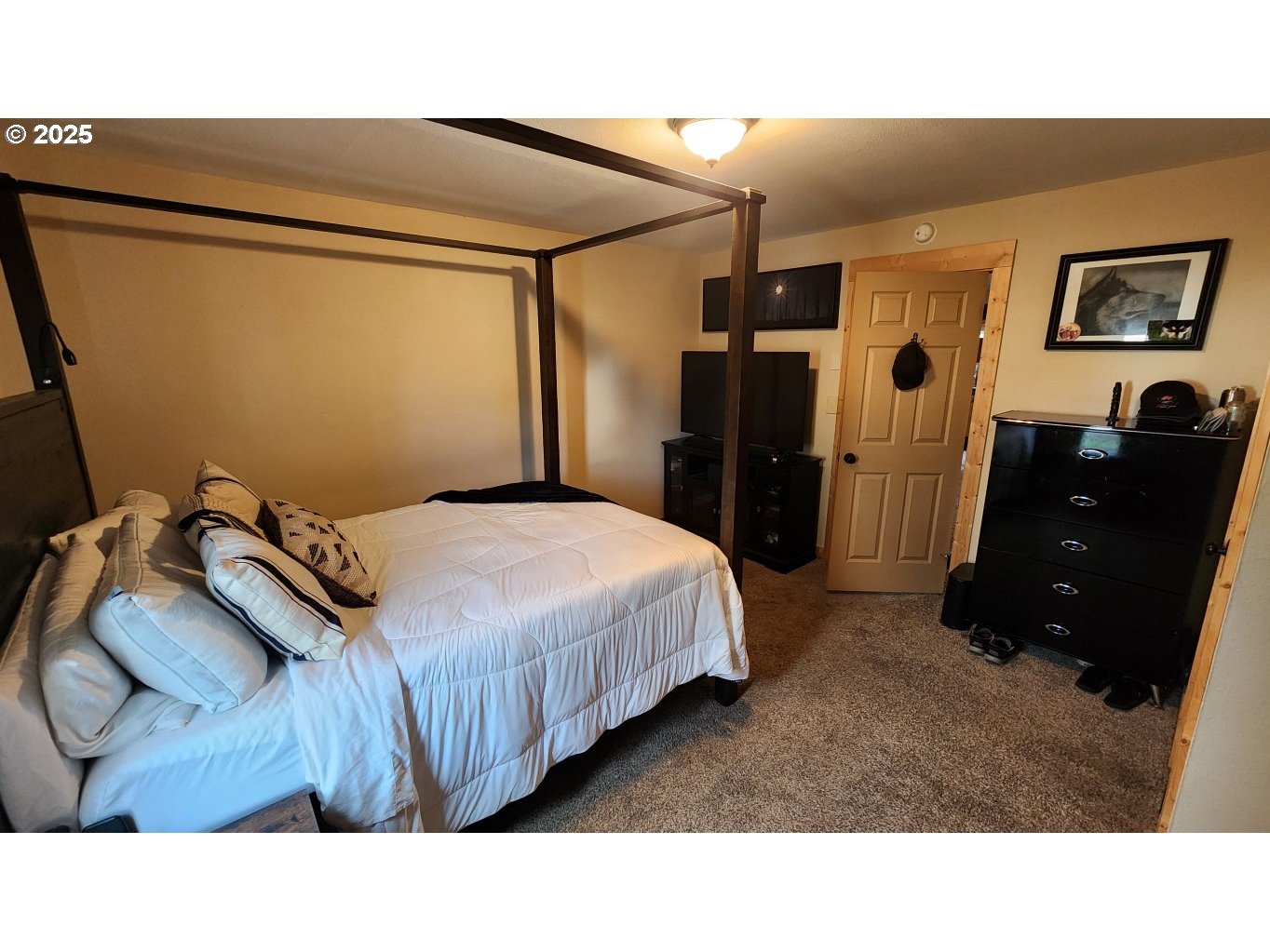 404 Southwest Depot Street Enterprise, OR 97828 - Photo 8 of 32 a bedroom with a bed and wooden floor