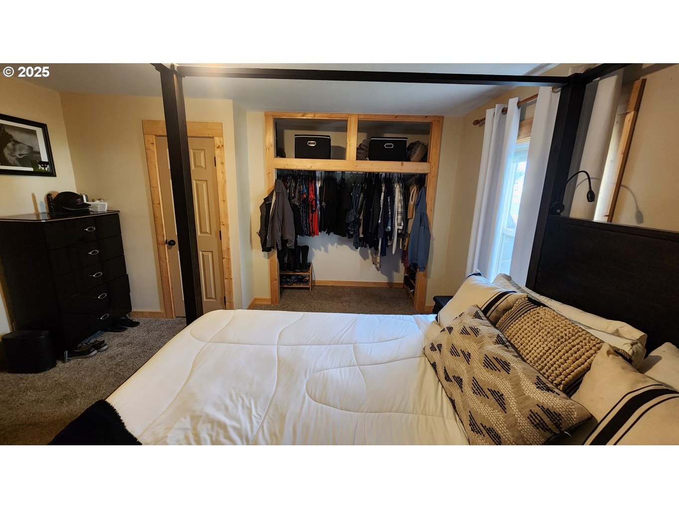 404 Southwest Depot Street Enterprise, OR 97828 - Photo 9 of 32 a living room with a bed and a walk in closet