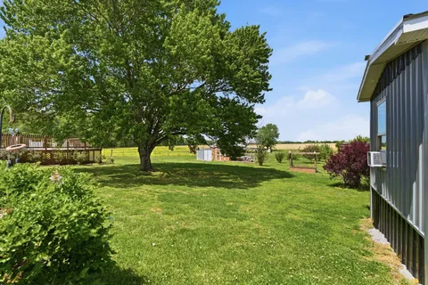 a view of backyard with green space
