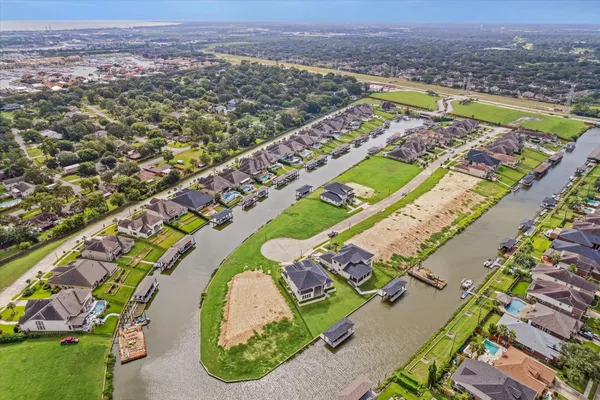 an aerial view of a swimming pool and mountain
