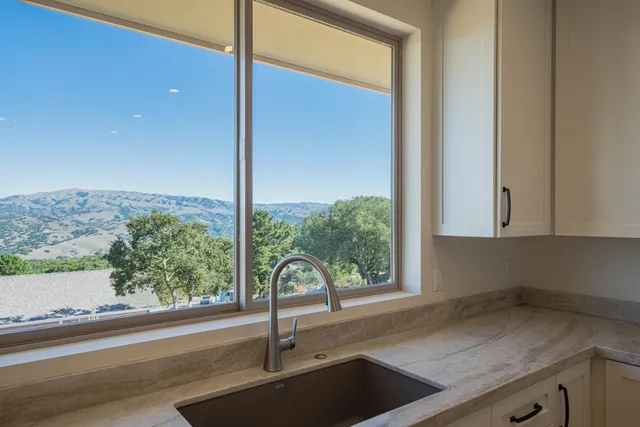 a kitchen with a sink and a window