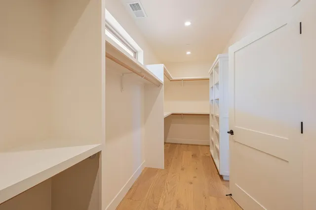 a bathroom with a tub and shower