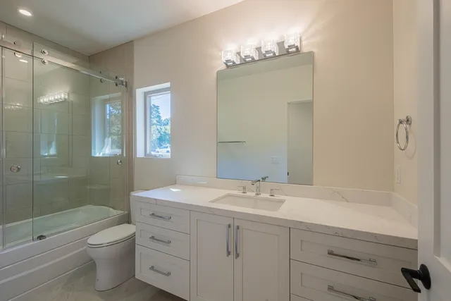 a bathroom with a bathtub and a shower