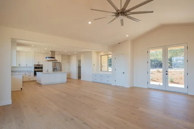a view of a kitchen with a sink and a window