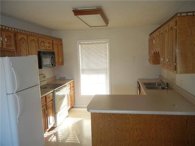 367 Brandon Road Manchester, TN 37355 - Photo 4 of 10 Well maintained Oak Cabinetry is a beautiful color and is surrounded by lots & lots of counterspace! The refrigerator, dishwasher, microwave, & range all stay with the home.
