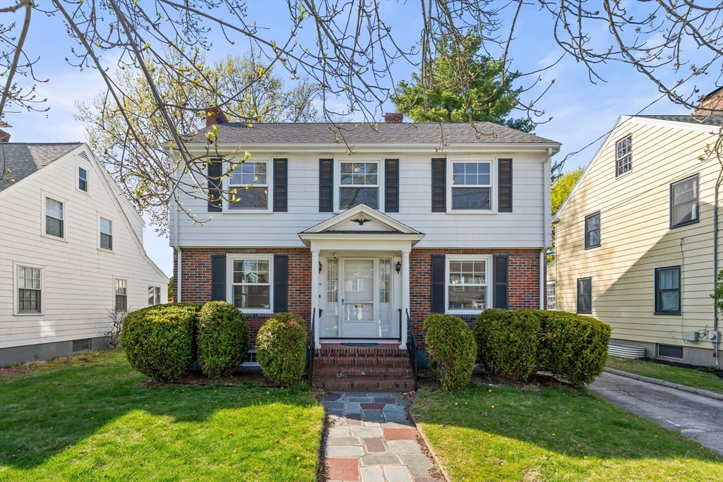 front view of a house with a yard