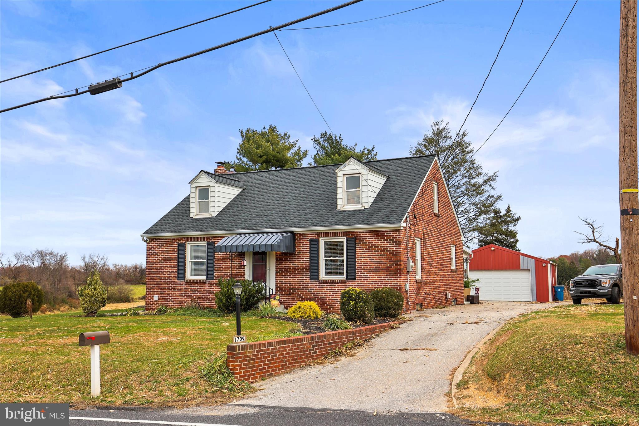 1709 Jefferson Road Spring Grove, PA 17362 - Photo 3 of 39 a front view of a house with a yard