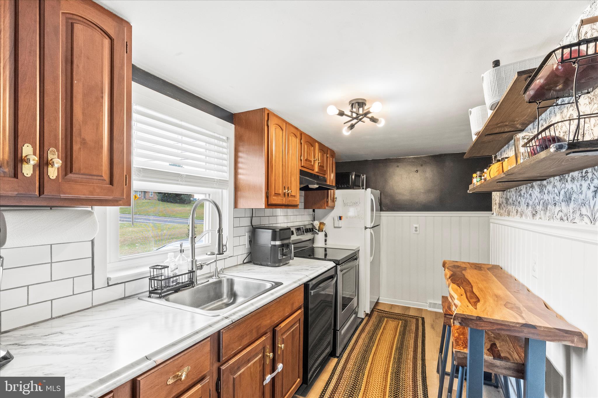 1709 Jefferson Road Spring Grove, PA 17362 - Photo 7 of 39 a kitchen with a sink appliances cabinets and a window