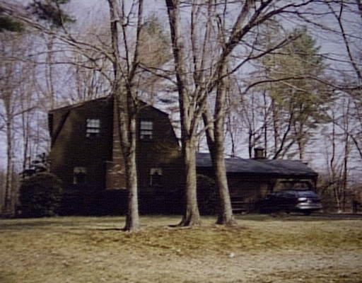 a view of house with yard
