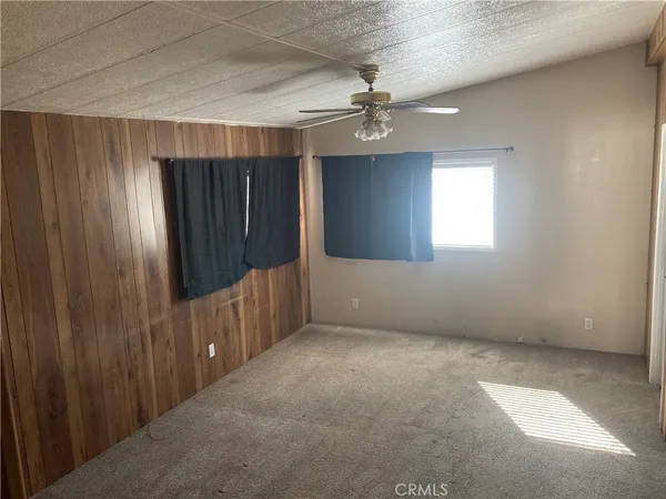 a view of empty room with a fireplace