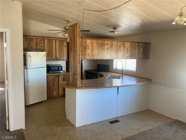 a kitchen with a stove and a sink