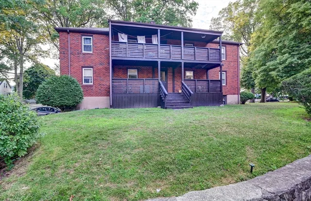 a view of a house with a yard