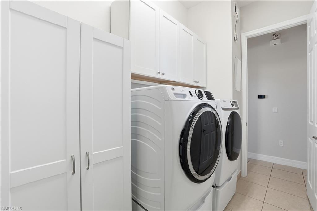 4194 Amelia Way Naples, FL 34119 - Photo 33 of 44 a utility room with dryer and washer