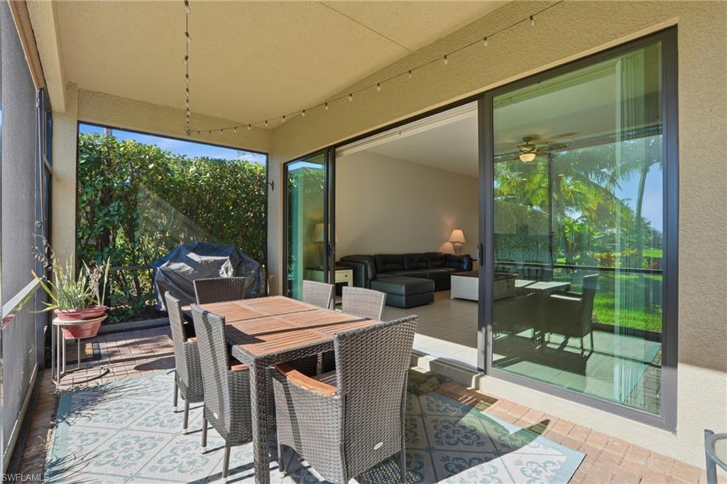 4194 Amelia Way Naples, FL 34119 - Photo 37 of 44 a view of an outdoor dining space with furniture