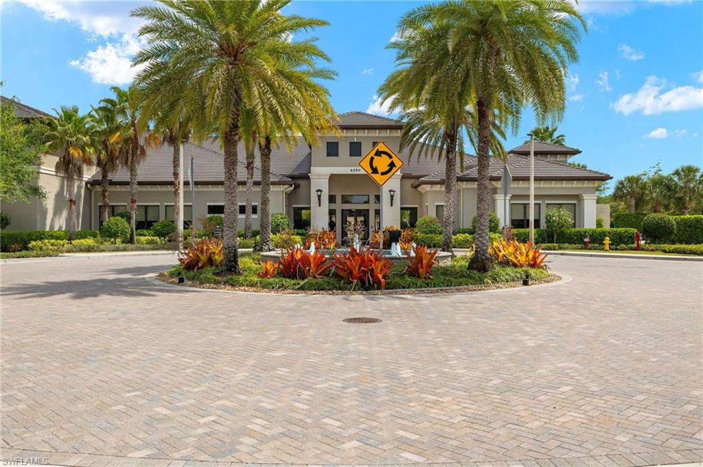 4194 Amelia Way Naples, FL 34119 - Photo 42 of 44 View of property featuring curved driveway