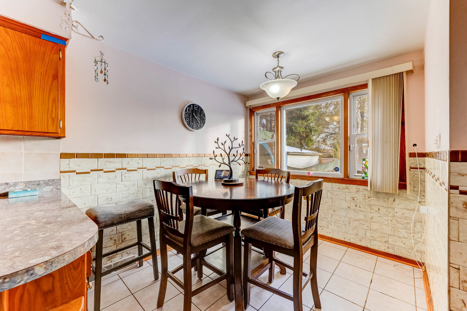 2117 West 71st Place Chicago, IL 60636 - Photo 14 of 31 a dining room with furniture and window