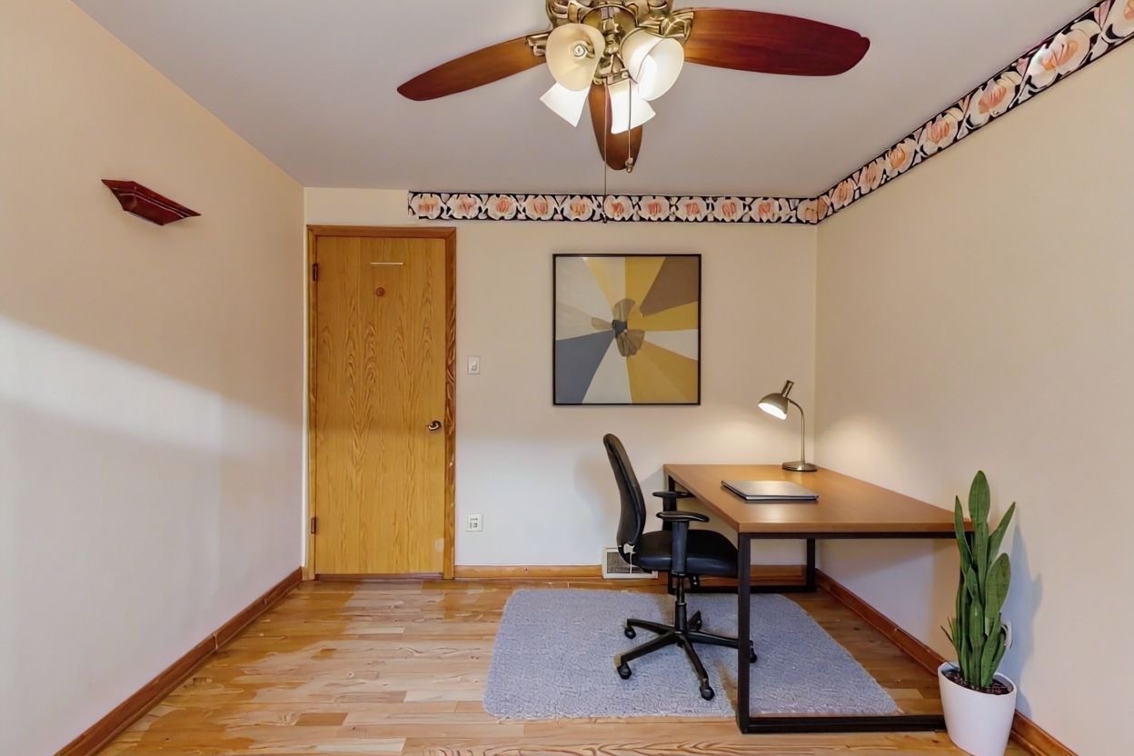 2117 West 71st Place Chicago, IL 60636 - Photo 19 of 31 a workspace with furniture and chandelier