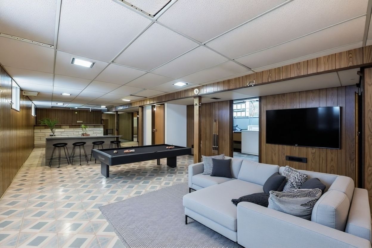 2117 West 71st Place Chicago, IL 60636 - Photo 21 of 31 a living room with furniture and a flat screen tv