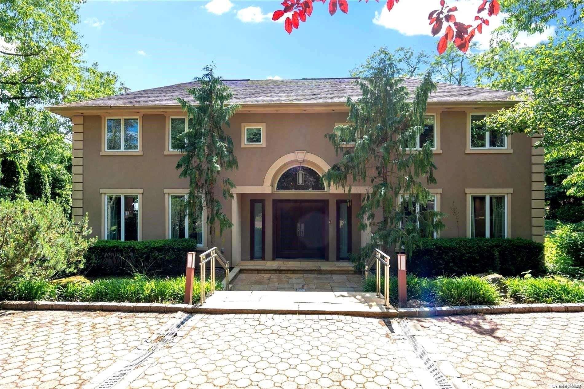 6 Vista Drive Great Neck, NY 11021 - Photo 1 of 1 a front view of a house with a garden