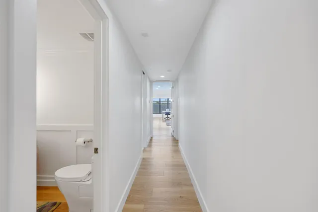 a bathroom with a sink toilet vanity and tub