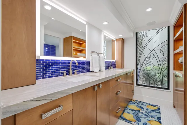a kitchen with stainless steel appliances wooden cabinets and a window