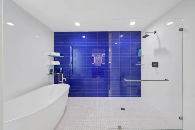a white bath tub sitting in a bathroom
