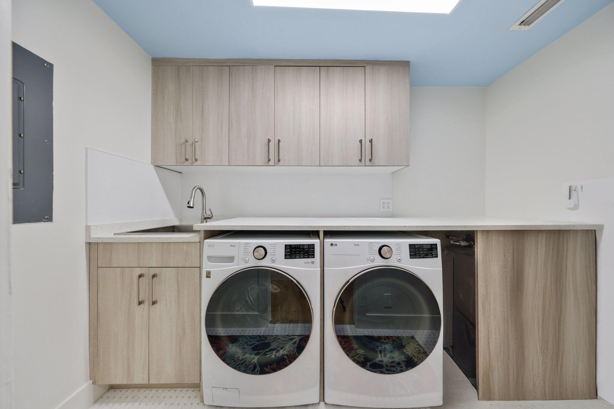 3900 North Ocean Boulevard, Unit LANAI Delray Beach, FL 33483 - Photo 30 of 40 a utility room with dryer and washer