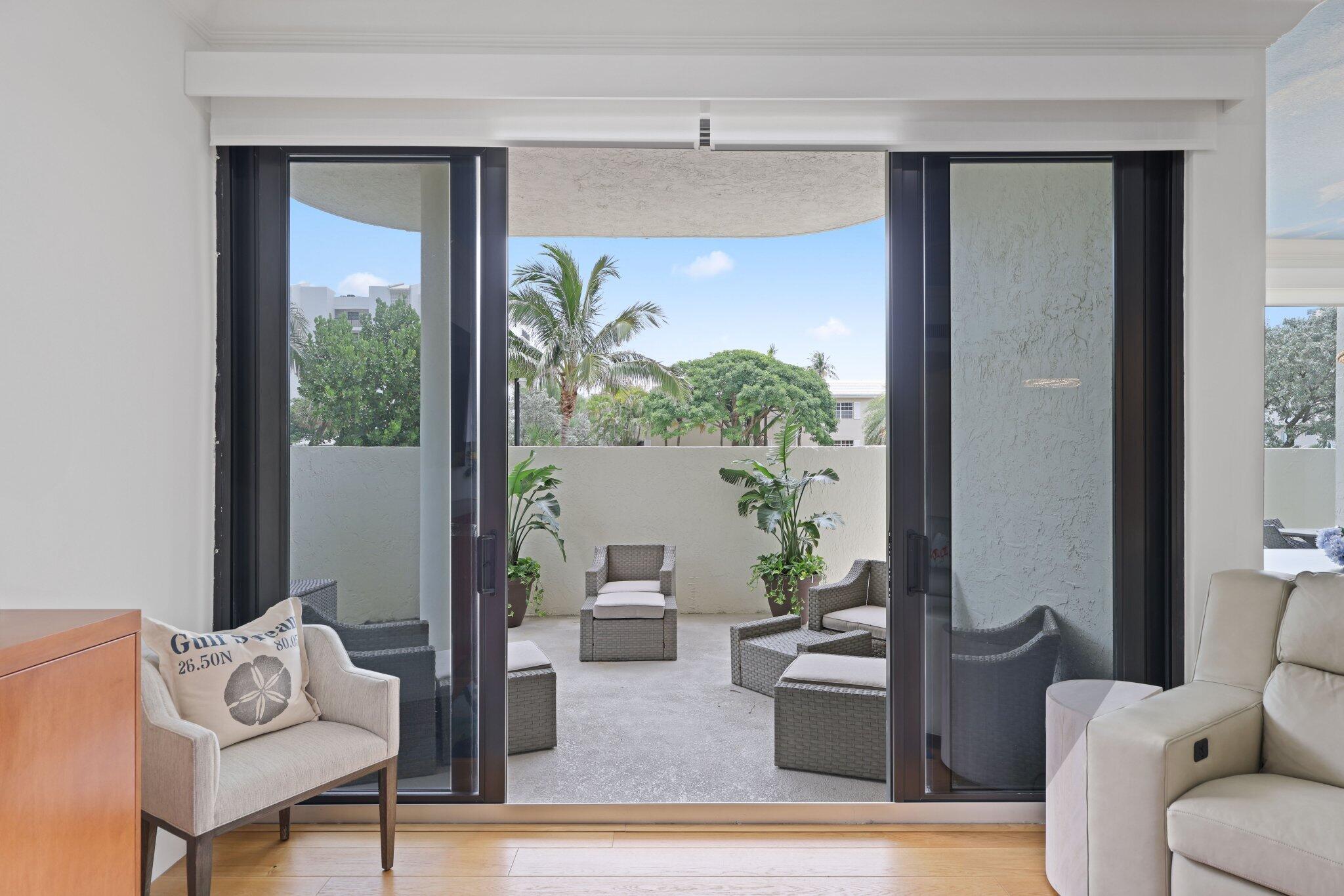 3900 North Ocean Boulevard, Unit LANAI Delray Beach, FL 33483 - Photo 31 of 40 a living room with furniture and a large window