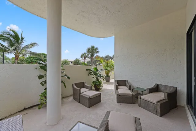 a view of a chairs and table in patio