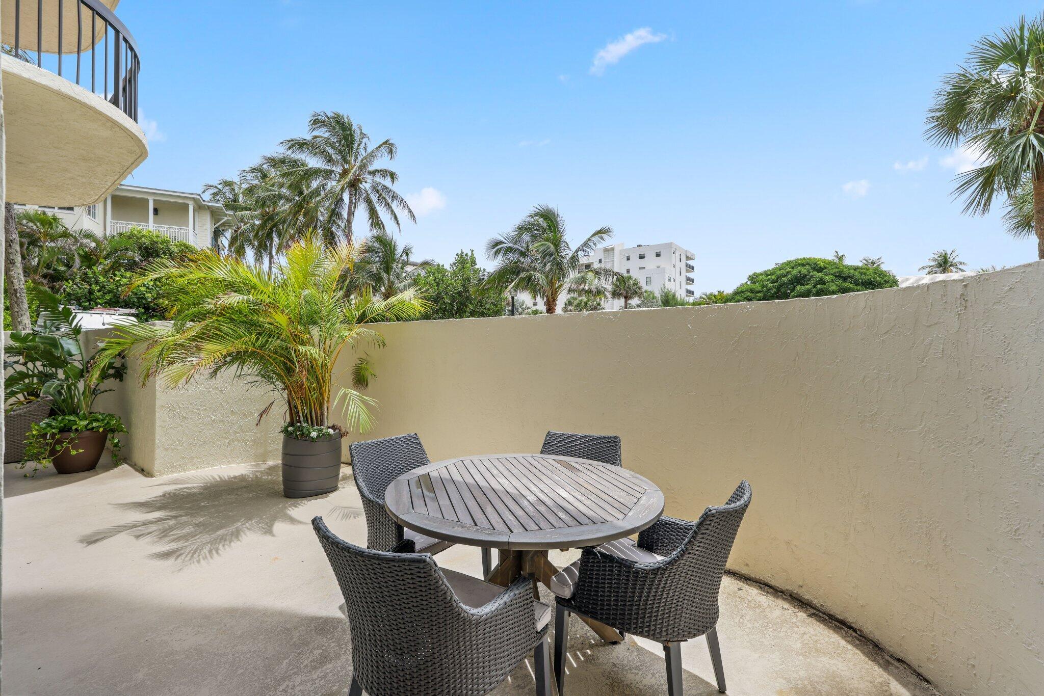 3900 North Ocean Boulevard, Unit LANAI Delray Beach, FL 33483 - Photo 33 of 40 a view of a chairs and table in patio