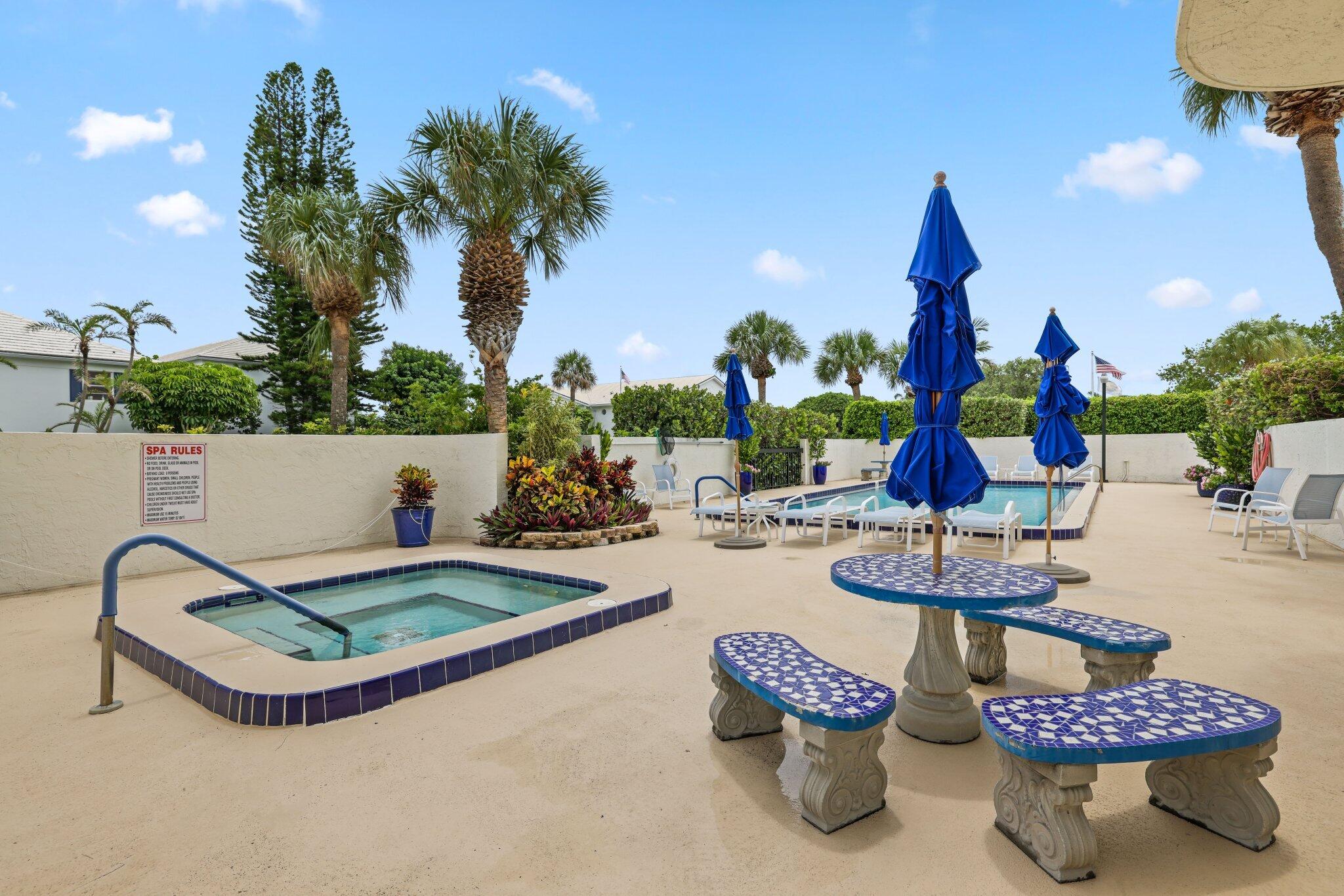 3900 North Ocean Boulevard, Unit LANAI Delray Beach, FL 33483 - Photo 34 of 40 a swimming pool with outdoor seating and yard