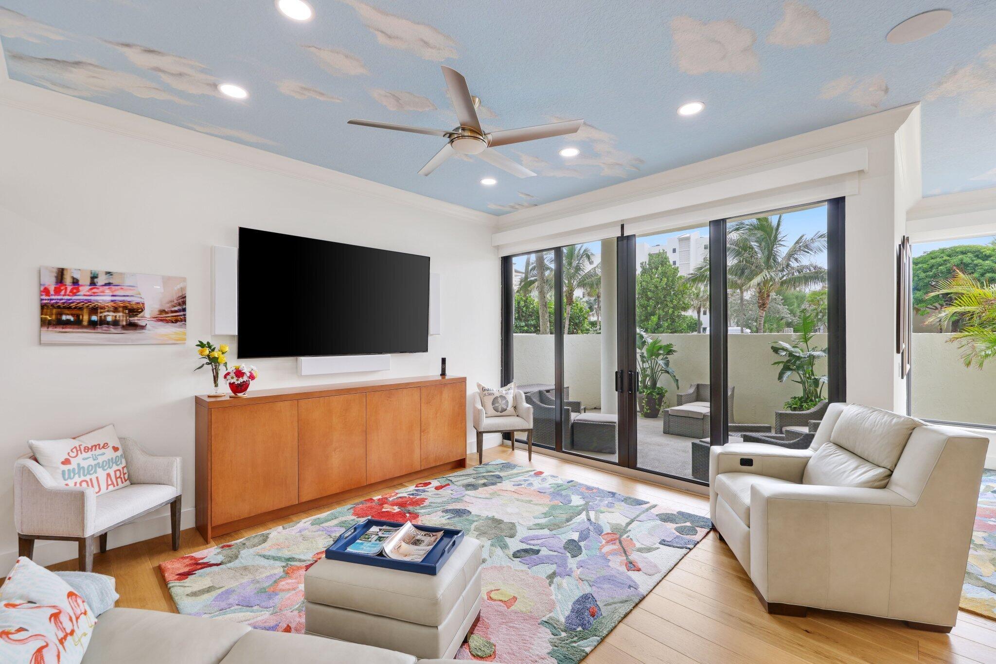 3900 North Ocean Boulevard, Unit LANAI Delray Beach, FL 33483 - Photo 5 of 40 a living room with furniture and a flat screen tv
