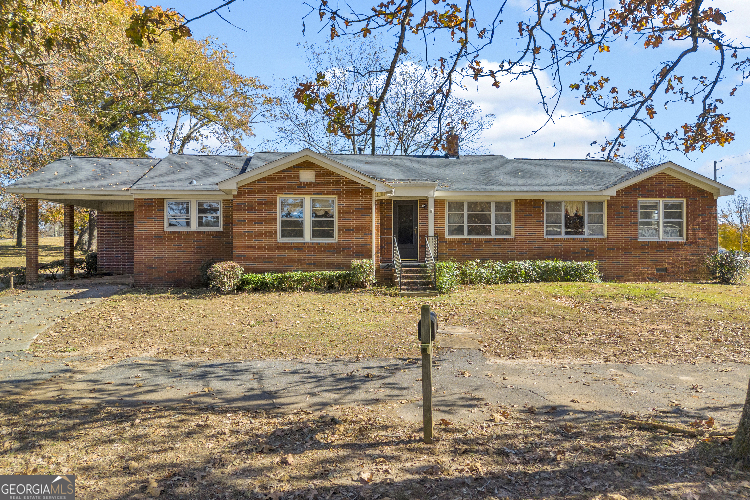 379 Mt Olive Church Road Commerce, GA 30529 - Photo 1 of 1 a front view of a house with a yard covered in snow