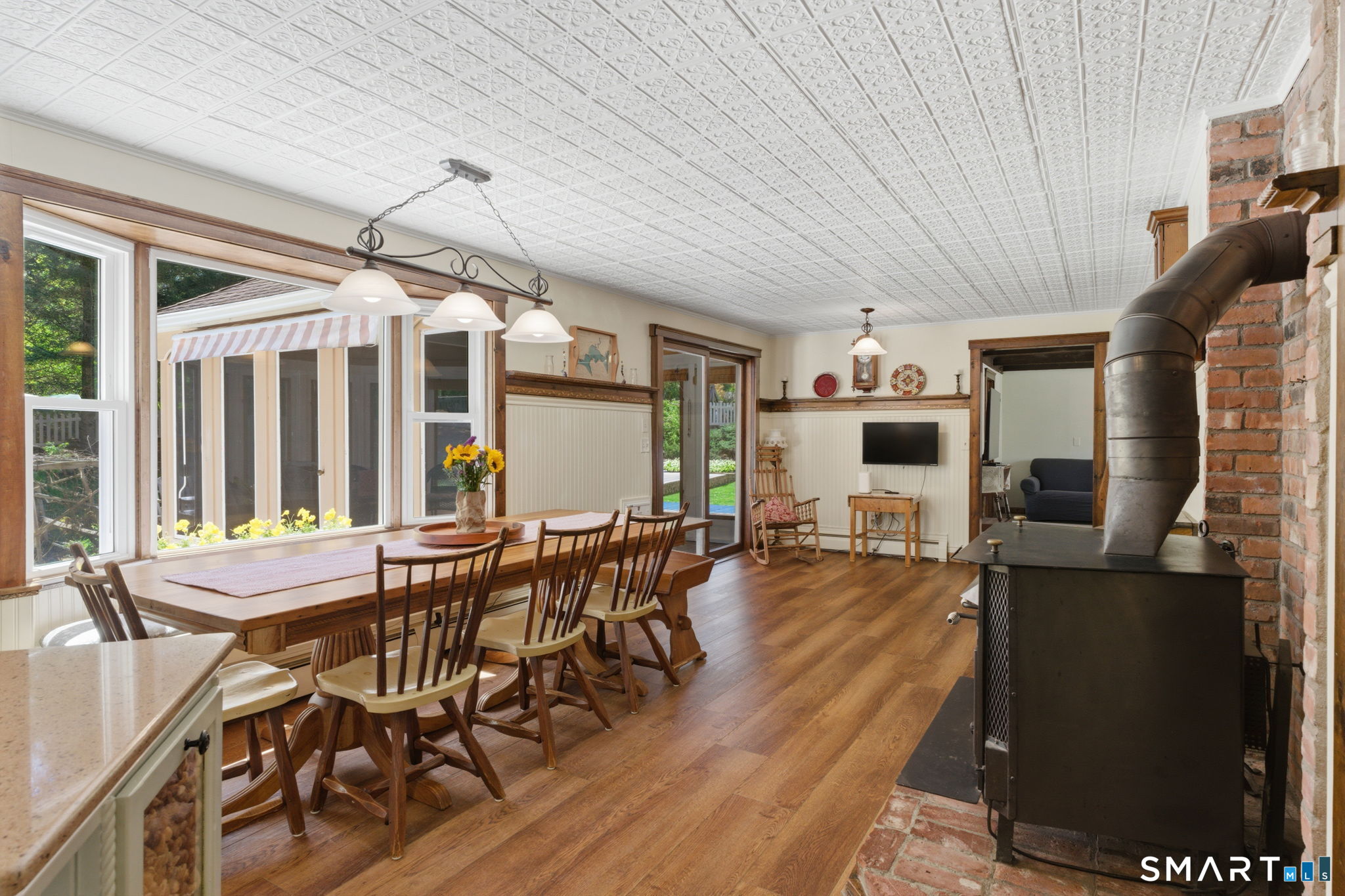 79 Buckboard Lane Bristol, CT 06010 - Photo 17 of 40 a view of a dining room with furniture window and wooden floor