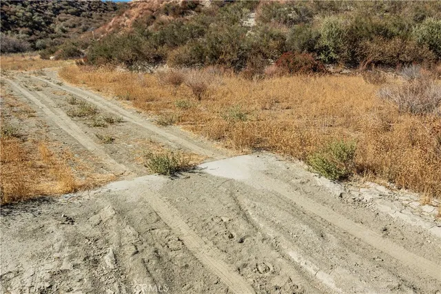 a view of a large building with mountain in the background