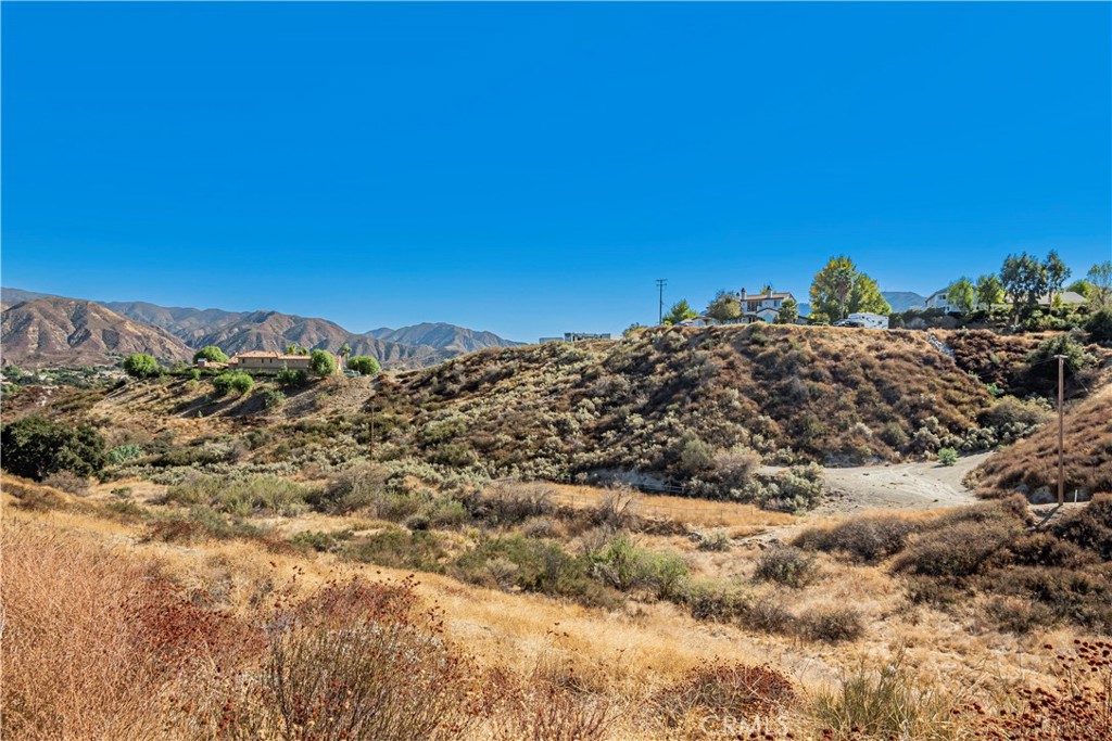 1 Warmuth Road Canyon Country, CA 91387 - Photo 24 of 34 a view of a large building with mountains in the background