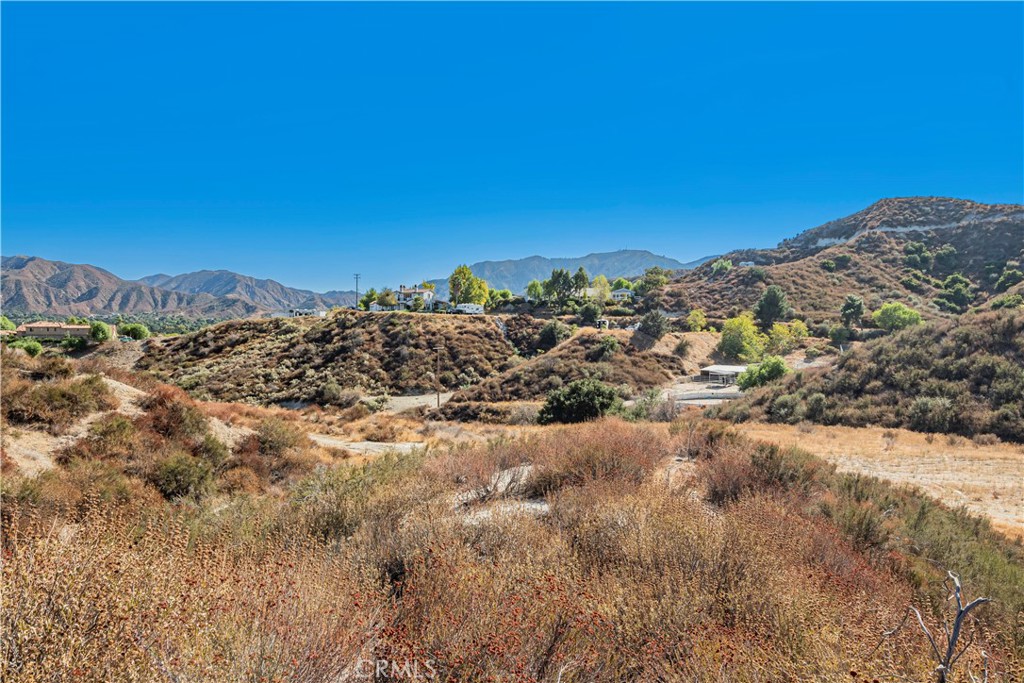 1 Warmuth Road Canyon Country, CA 91387 - Photo 29 of 34 a view of a large building with mountains in the background