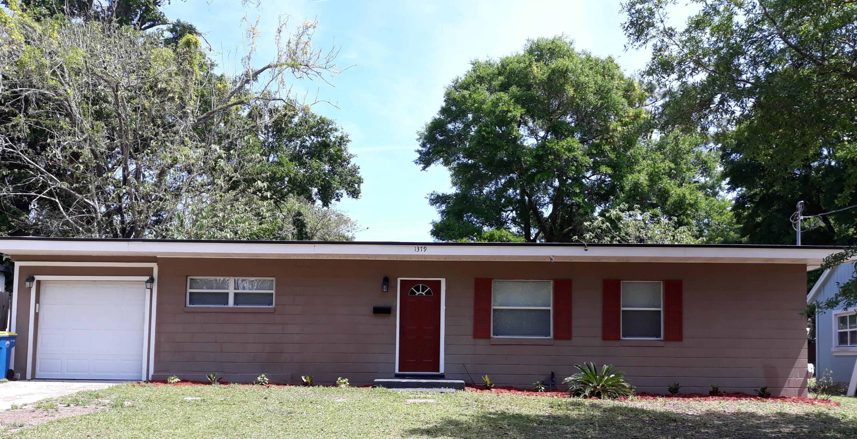 1379 Griflet Road Jacksonville, FL 32211 - Photo 1 of 1 a view of front of a house with a yard
