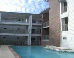 501 West 26th Street, Unit 101 Austin, TX 78705 - Photo 1 of 1 a front view of a house with balcony