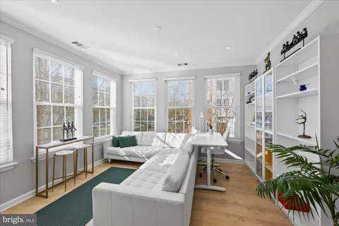 a kitchen that has a sink cabinets and stainless steel appliances