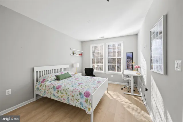 a bathroom with a double vanity sink mirror and toilet