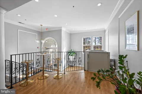 a view of river covered by trees and buildings